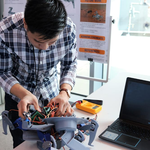 Student building a robot